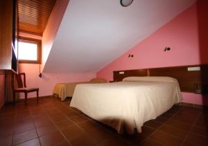Postel nebo postele na pokoji v ubytování Apart-Hotel Selva Nevada
