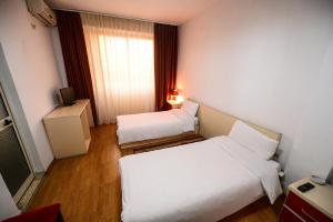 Rúm í herbergi á Hotel Argenti