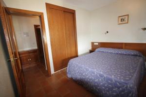 Postel nebo postele na pokoji v ubytování Apart-Hotel Selva Nevada