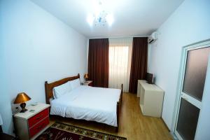 Rúm í herbergi á Hotel Argenti