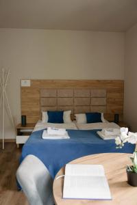 Posteľ alebo postele v izbe v ubytovaní Apartamenty Pruskie