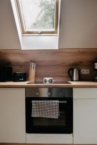 Kuchyňa alebo kuchynka v ubytovaní Apartamenty Pruskie