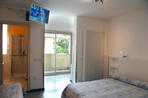 Postel nebo postele na pokoji v ubytování Hotel Marbella