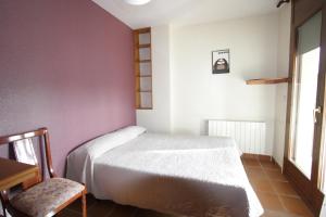 Postel nebo postele na pokoji v ubytování Apart-Hotel Selva Nevada