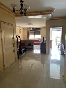 a living room with a couch and a ceiling at Appartement Belevédère in Casablanca