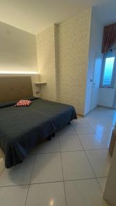 Postel nebo postele na pokoji v ubytování B&B Metropols Sottomarina