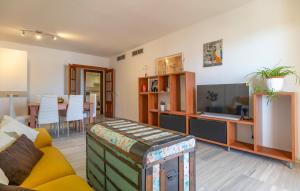 a living room with a couch and a tv at Nice Apartment In Aguadulce With Wifi in Aguadulce