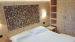 Ένα ή περισσότερα κρεβάτια σε δωμάτιο στο B&B Augusto