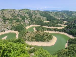 an aerial view of two lakes in the mountains at Markove kolibe 5, Uvac, Sjenica in Sjenica +14 photos