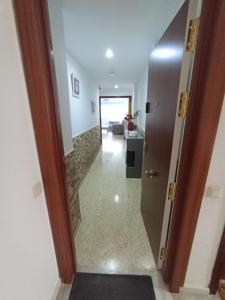 a hallway with a door leading into a room at Doña Cora in San Fernando