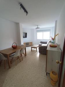 a living room with a table and a couch at Doña Cora in San Fernando