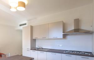 A kitchen or kitchenette at Lovely Apartment In Longobardi Marina