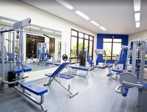 a gym with blue chairs in a room at TW Cyclinn Vila Olimpia in São Paulo