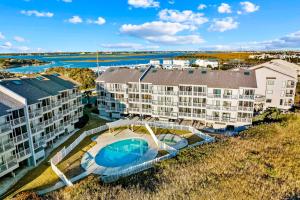 an aerial view of a building with a swimming pool at Dunescape Villas 210 in Atlantic Beach