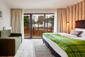 Posteľ alebo postele v izbe v ubytovaní Das Alpenhaus Katschberg 1640 inkl Lungau Card