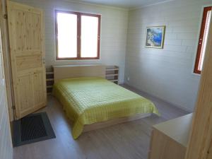 Postel nebo postele na pokoji v ubytování Scandinavian Dream Cottages Vikajarvi- Rovaniemi