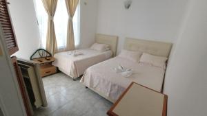 Postel nebo postele na pokoji v ubytování Miami Hotel
