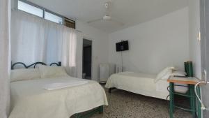 Postel nebo postele na pokoji v ubytování Miami Hotel