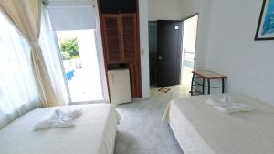 Postel nebo postele na pokoji v ubytování Miami Hotel
