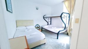 Postel nebo postele na pokoji v ubytování Miami Hotel