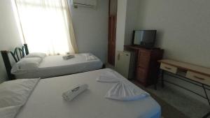 Postel nebo postele na pokoji v ubytování Miami Hotel