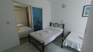 Postel nebo postele na pokoji v ubytování Miami Hotel