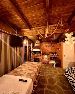 a bedroom with a large bed and a fireplace at Casa Phoenix in Molidu +33 photos