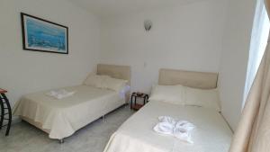 Postel nebo postele na pokoji v ubytování Miami Hotel