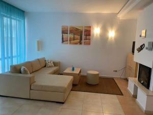 a living room with a couch and a table at Sunny Villa in Byala