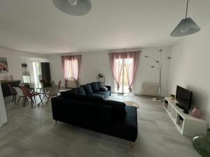 Et opholdsområde på Charmante maison de famille