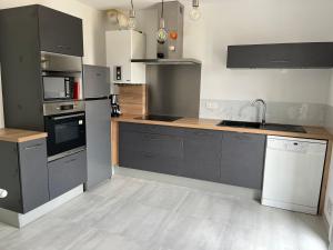 Køkken eller tekøkken på Charmante maison de famille