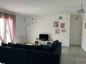 Et tv og/eller underholdning på Charmante maison de famille