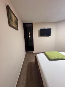 Postel nebo postele na pokoji v ubytování Hotel Casa Colonial Montufar
