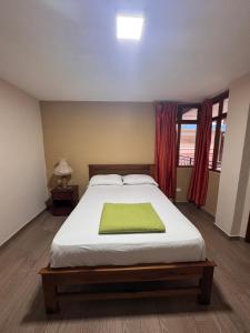 Postel nebo postele na pokoji v ubytování Hotel Casa Colonial Montufar