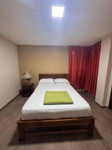 Postel nebo postele na pokoji v ubytování Hotel Casa Colonial Montufar