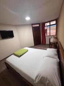 Postel nebo postele na pokoji v ubytování Hotel Casa Colonial Montufar