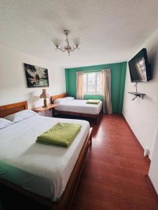 Postel nebo postele na pokoji v ubytování Hotel Casa Colonial Montufar