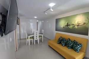 Posezení v ubytování Acogedor apartamento con vistas panorámicas en Bolívar (Strada Suites)