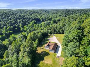 an aerial view of a house in the middle of a forest at Buck Run - a secluded cabin in Rockbridge, OH in Rockbridge
