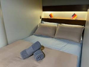 Ένα ή περισσότερα κρεβάτια σε δωμάτιο στο Loft 203 em frente à Vila Germânica Oktoberfest- Villa Haus