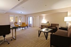 a living room with a couch and a table at Hilton Los Angeles Airport in Los Angeles