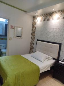 Voodi või voodid majutusasutuse Aparta-Hotel El Dorado toas