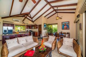 a living room with couches and a table at Infinity Pool, Pacific Views & Concierge in Potrero