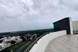 a view of a city from the top of a building at 7 Seasons Palm Suite with Sky Orbit, Balcony, Swimming pool, WIFI, Playground in Rajkot