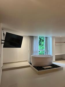 TV a/nebo společenská místnost v ubytování Hotel Playa Club