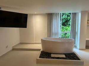 TV a/nebo společenská místnost v ubytování Hotel Playa Club