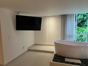 TV a/nebo společenská místnost v ubytování Hotel Playa Club
