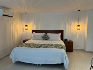 Postel nebo postele na pokoji v ubytování Hotel Playa Club