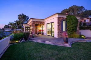 a home with a wooden deck in the yard at 4BR Luxury Del Mar Beach House with Ocean Views in San Diego