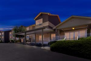 a house with a driveway in front of it at Best Western Topaz Lake Inn in Gardnerville